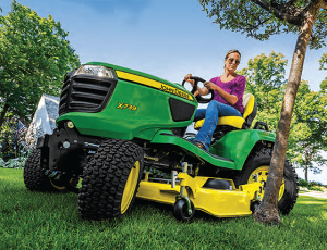 woman riding John Deere mower