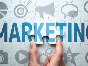 markeing puzzle with hand placing puzzle piece