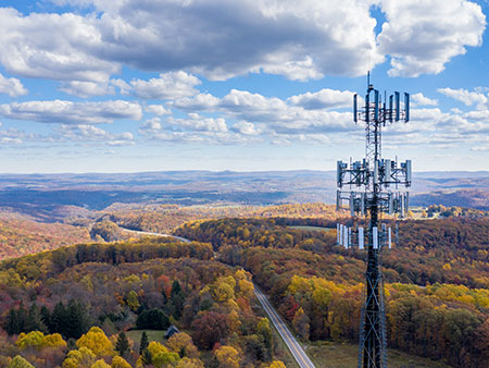 cell tower, blue sky, fall landscape